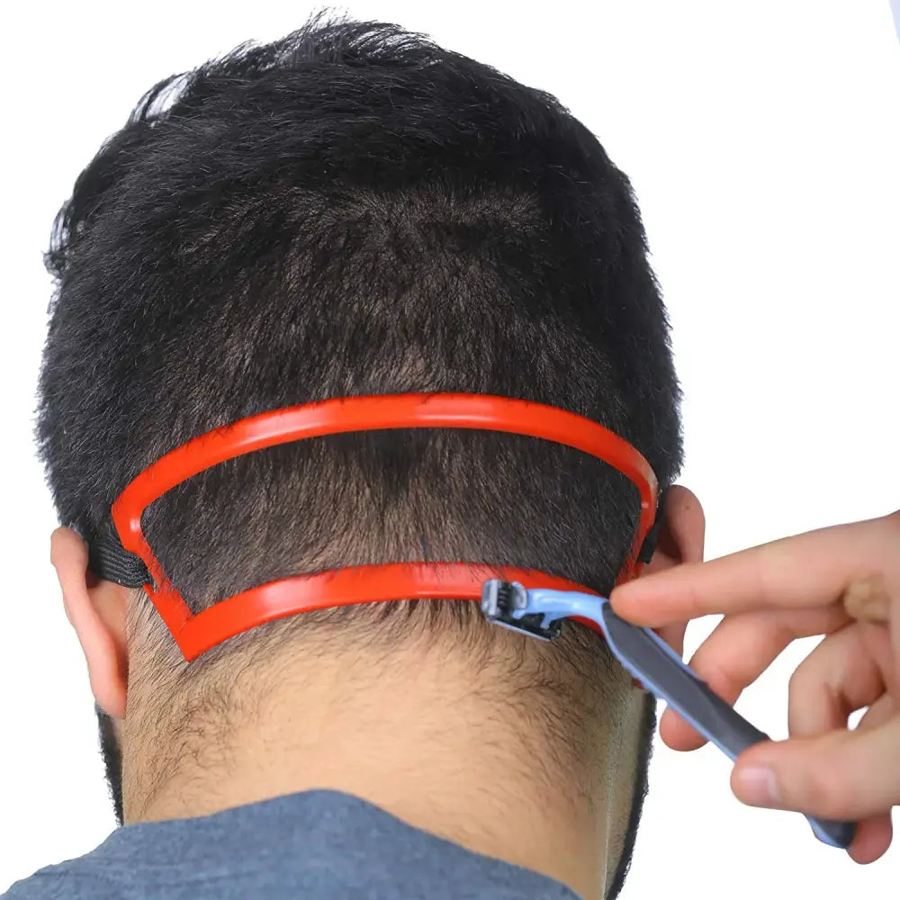 Neck hair trimming guide with an orange curved edge being used with clippers.