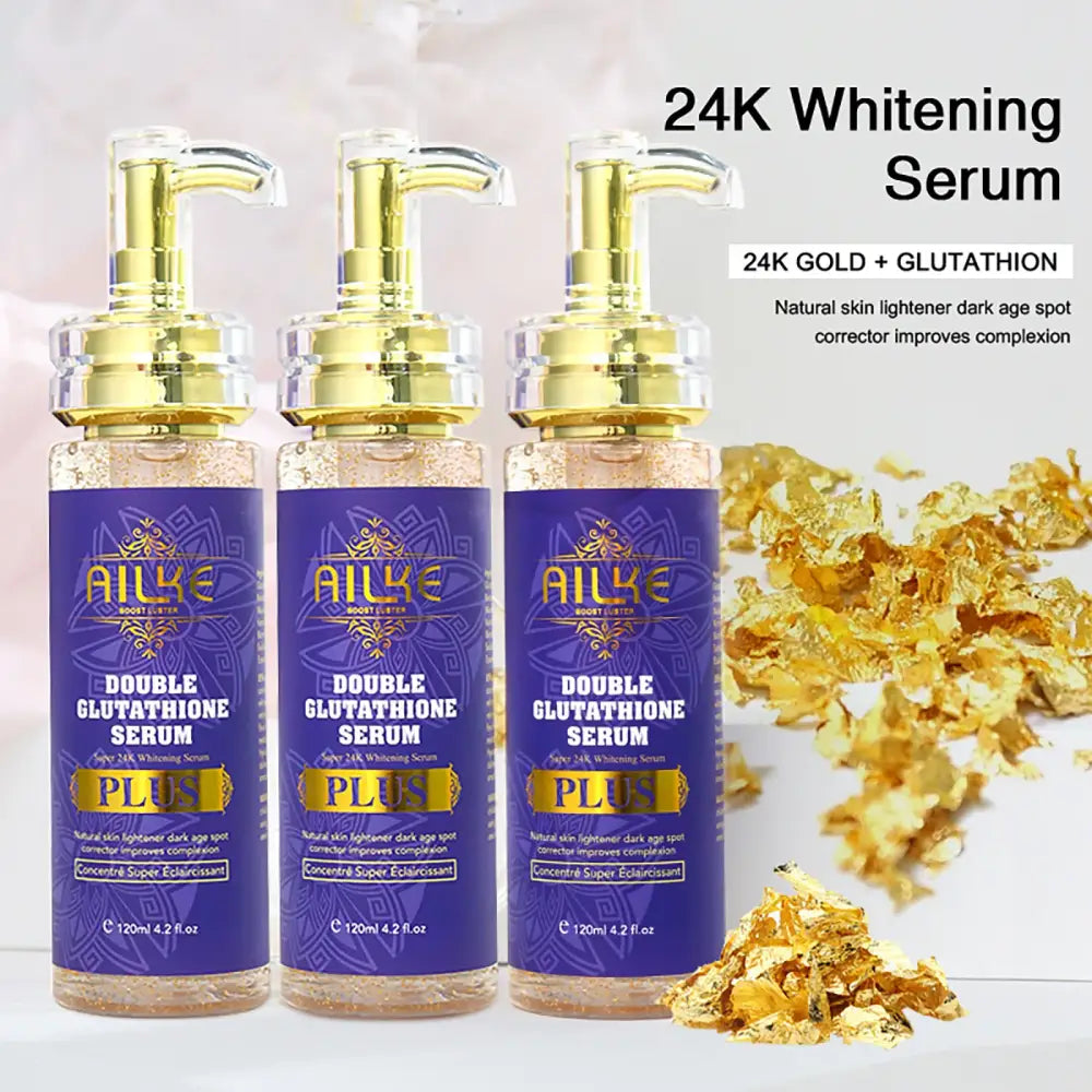 Purple and gold bottles of 24K whitening serum with pump dispensers.