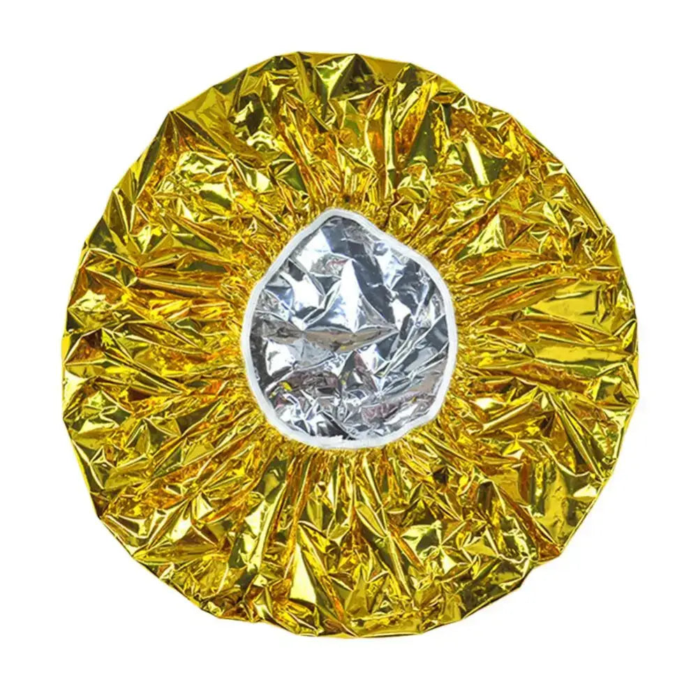 Circular metallic object with a golden crinkled outer ring surrounding a silver center.