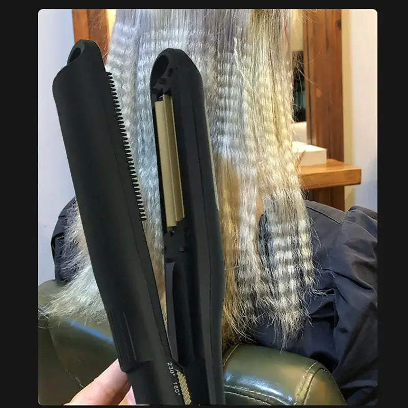 Hair straightener with long blonde hair visible between its plates.