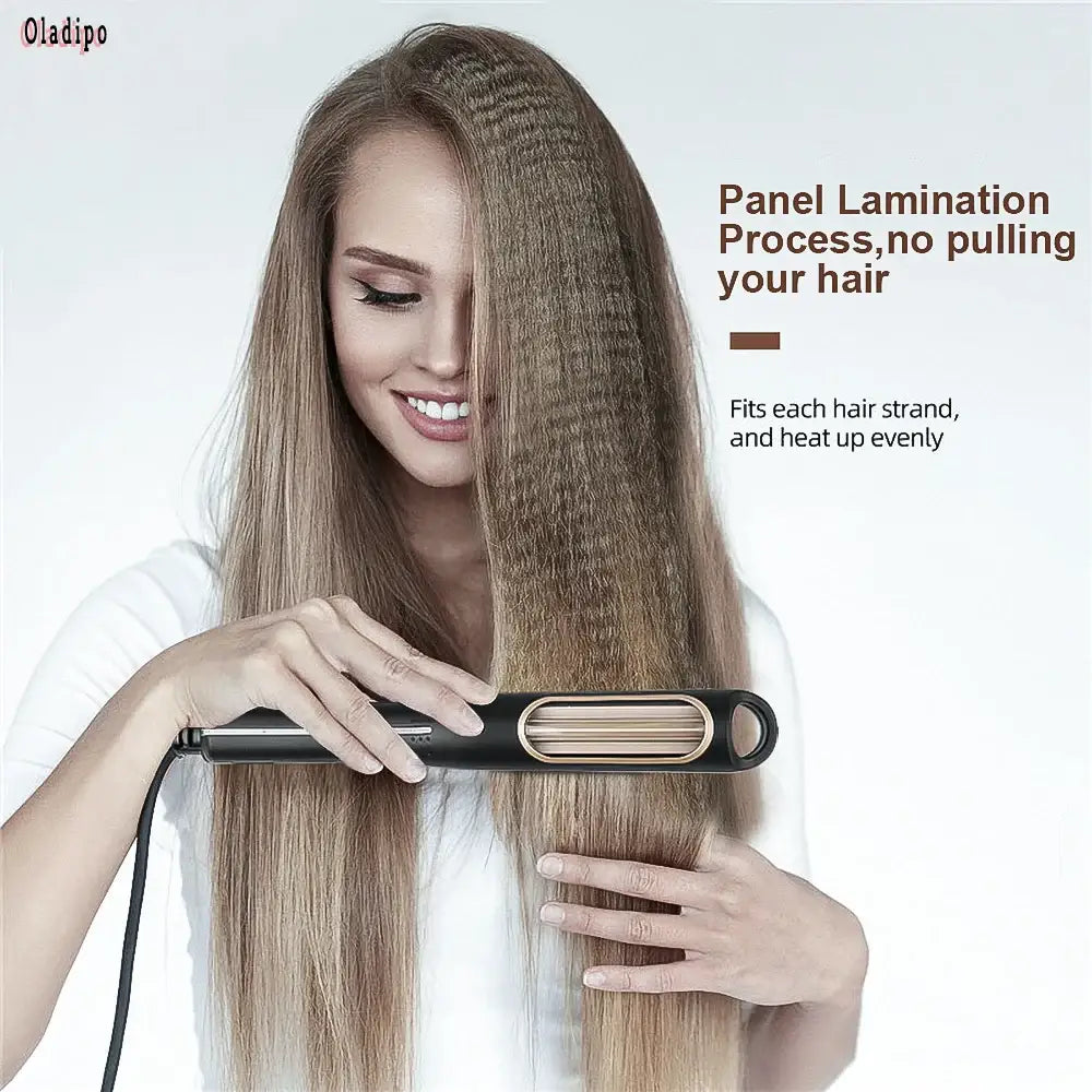 Hair straightener with a wide, flat panel design being used on long blonde hair.