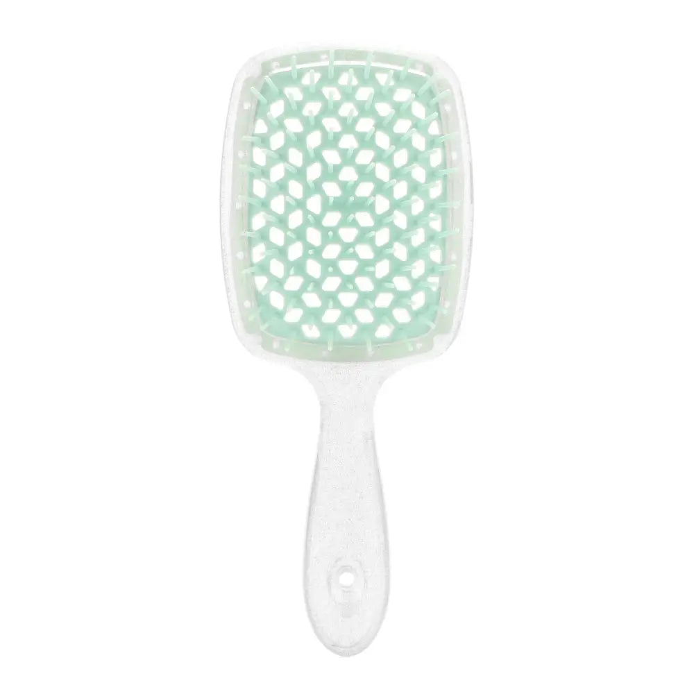 Mint green and white paddle hairbrush with a polka dot pattern.