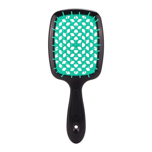 Paddle-style hairbrush with a black handle and teal cushion featuring white polka dots.