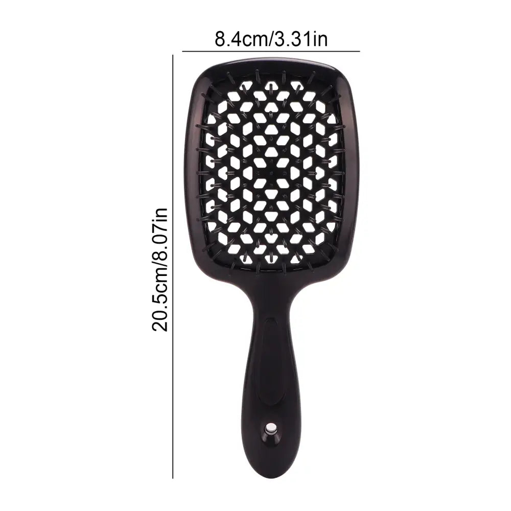 Black paddle hairbrush with a pattern of white bristles on its cushioned head.