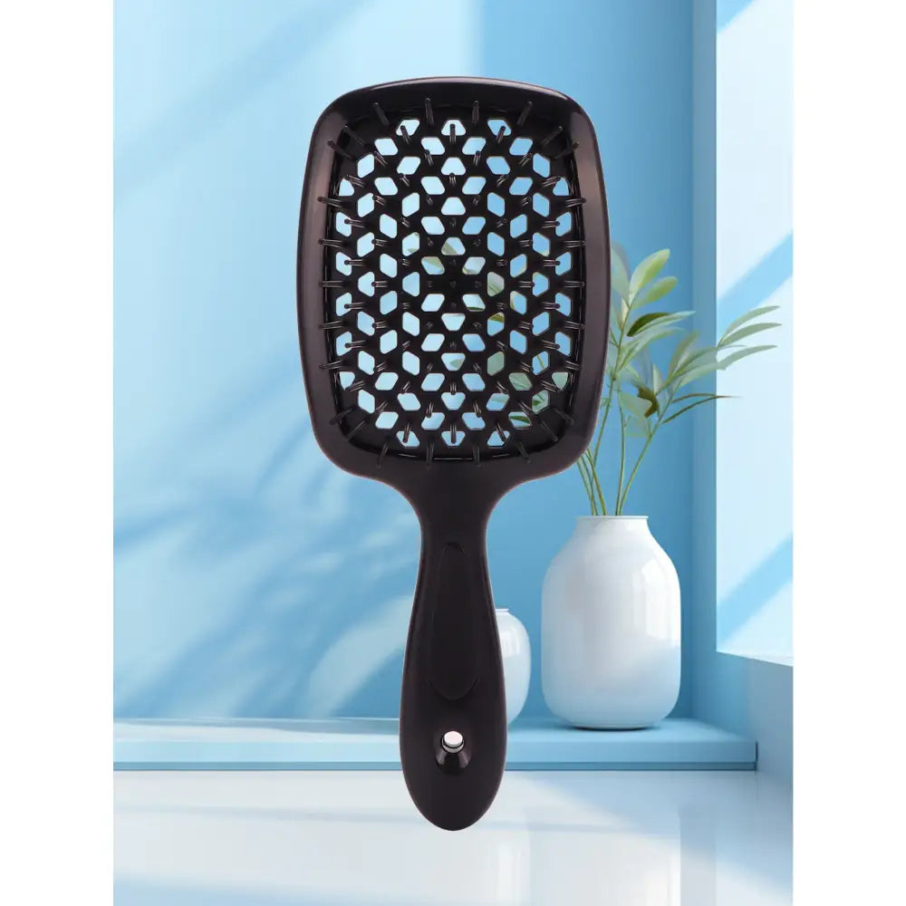 Black hairbrush with teal-colored bristles and a wide paddle shape.