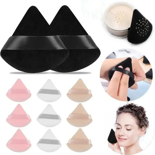 Black triangular makeup sponges with a band across the middle.