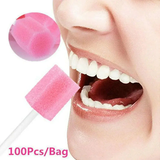 Disposable pink foam swabs or applicators, likely for dental or oral hygiene use.