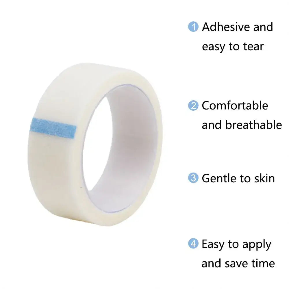 Roll of white medical tape with a blue strip visible on one edge.