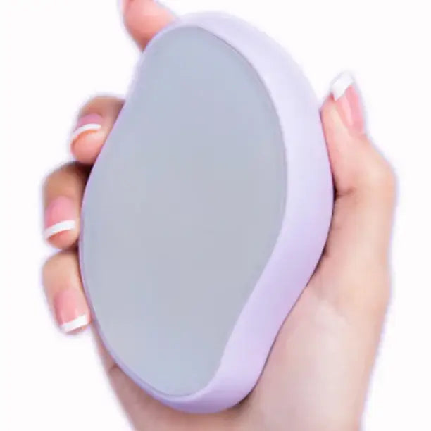 Oval-shaped white electronic device held in a manicured hand.