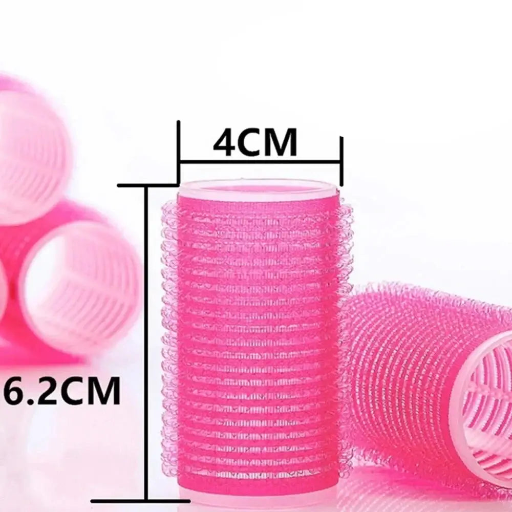 Pink cylindrical hair roller with measurements indicated as 4cm diameter and 6.2cm height.