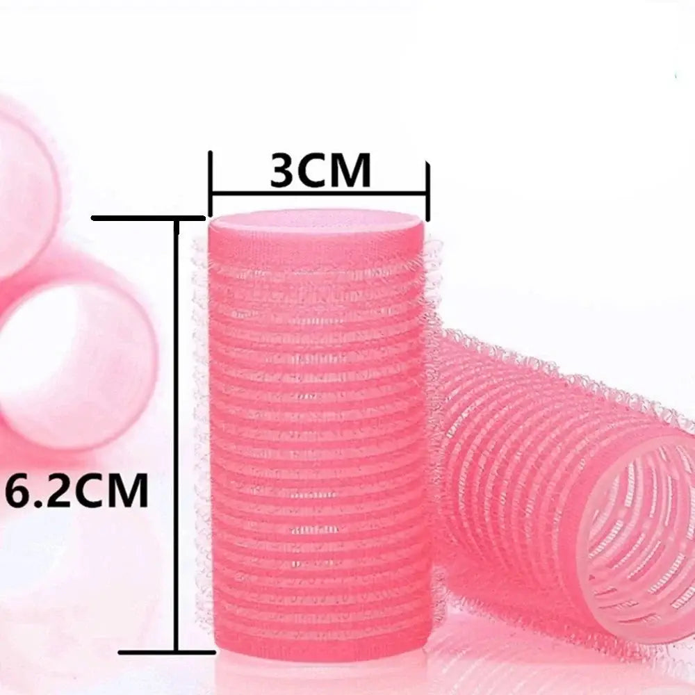 Pink plastic hair roller with measurements indicated.