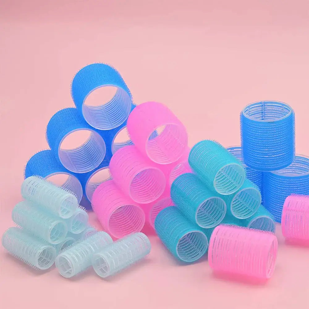 Colorful plastic hair rollers in various sizes and pastel shades.