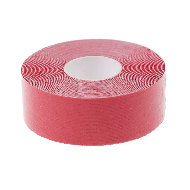 Roll of red adhesive tape.