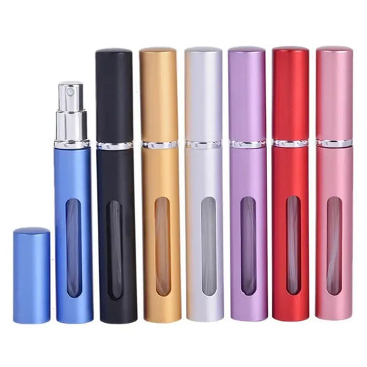 Colorful refillable perfume atomizers lined up in a row.