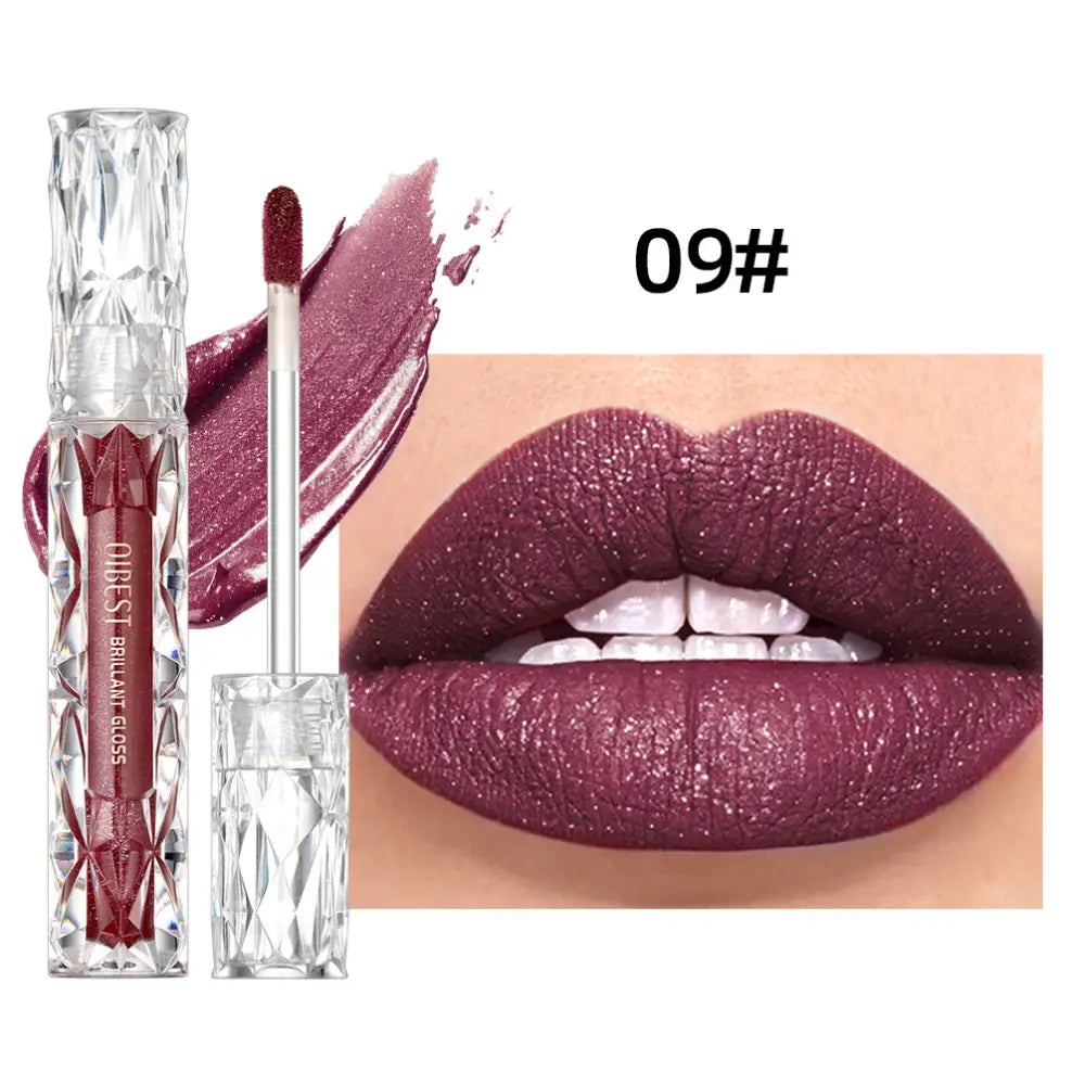 Lipstick in a clear tube with a matching swatch and lip close-up in a deep burgundy shade.