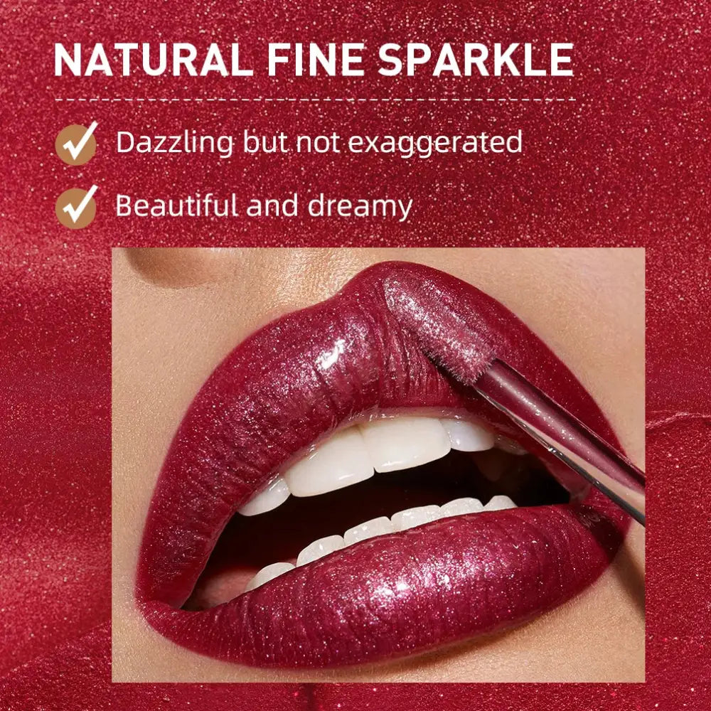 Close-up of glossy, deep red lips with a shimmering, sparkly finish.