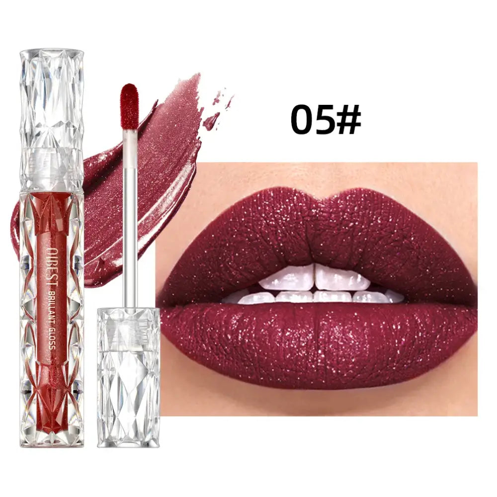 Shimmery burgundy lip gloss with a matching lip swatch showing its deep, metallic color on lips.