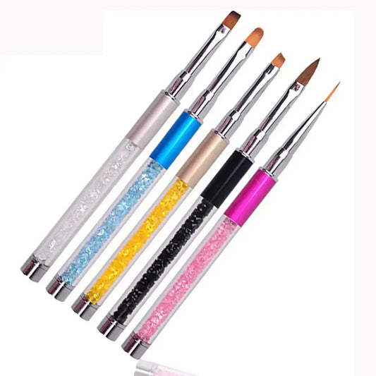 Set of colorful nail art brushes with glittery handles.