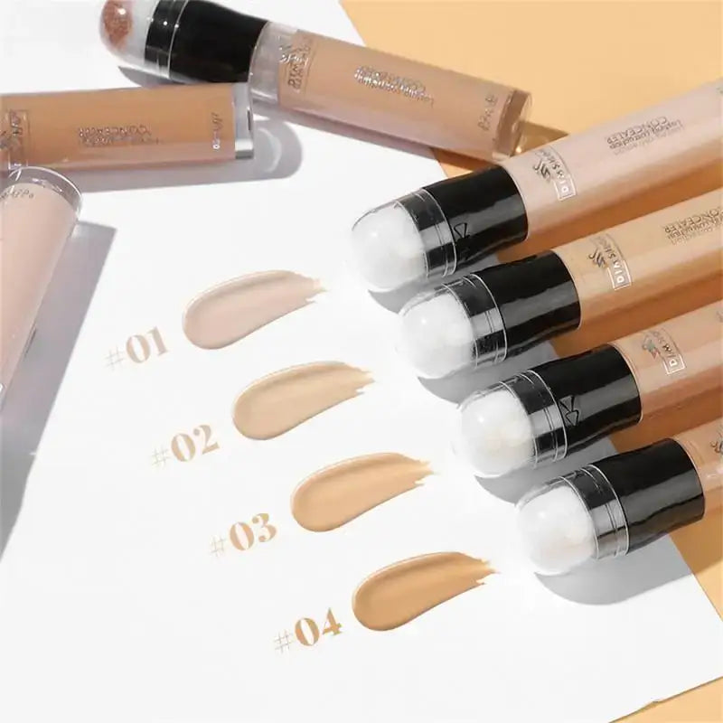 Liquid foundation makeup bottles with swatches of different shades.