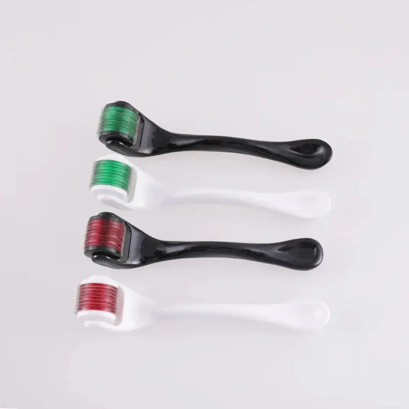 Derma rollers with interchangeable heads in green and red.