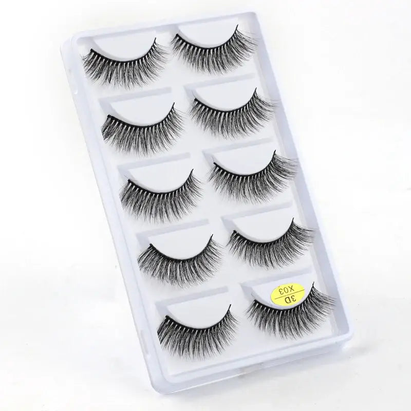 Set of five pairs of false eyelashes in a clear plastic case.