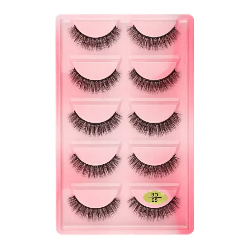 Set of five pairs of false eyelashes in a pink plastic case.