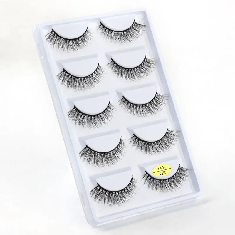 Set of five pairs of false eyelashes in a clear plastic case.