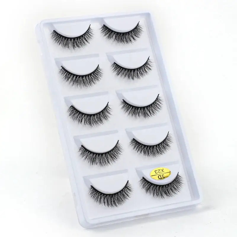 Set of five pairs of false eyelashes in a clear plastic case.