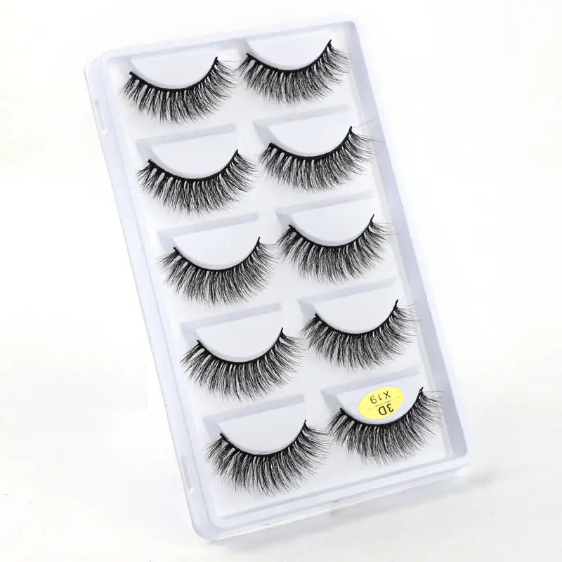 Set of five pairs of false eyelashes in a clear plastic case.