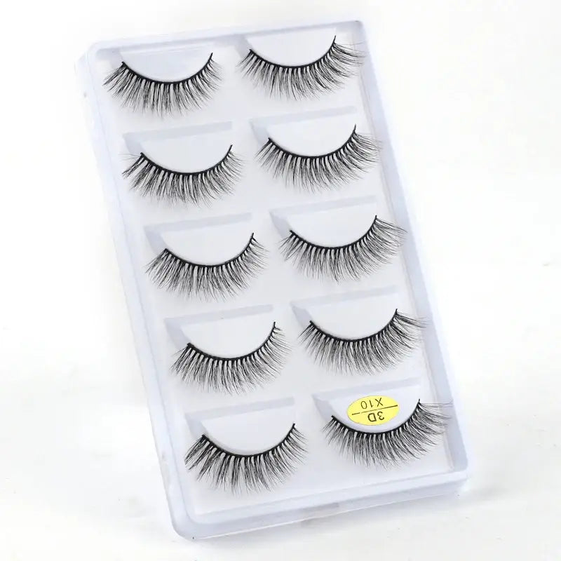 Set of five pairs of false eyelashes in a clear plastic case.