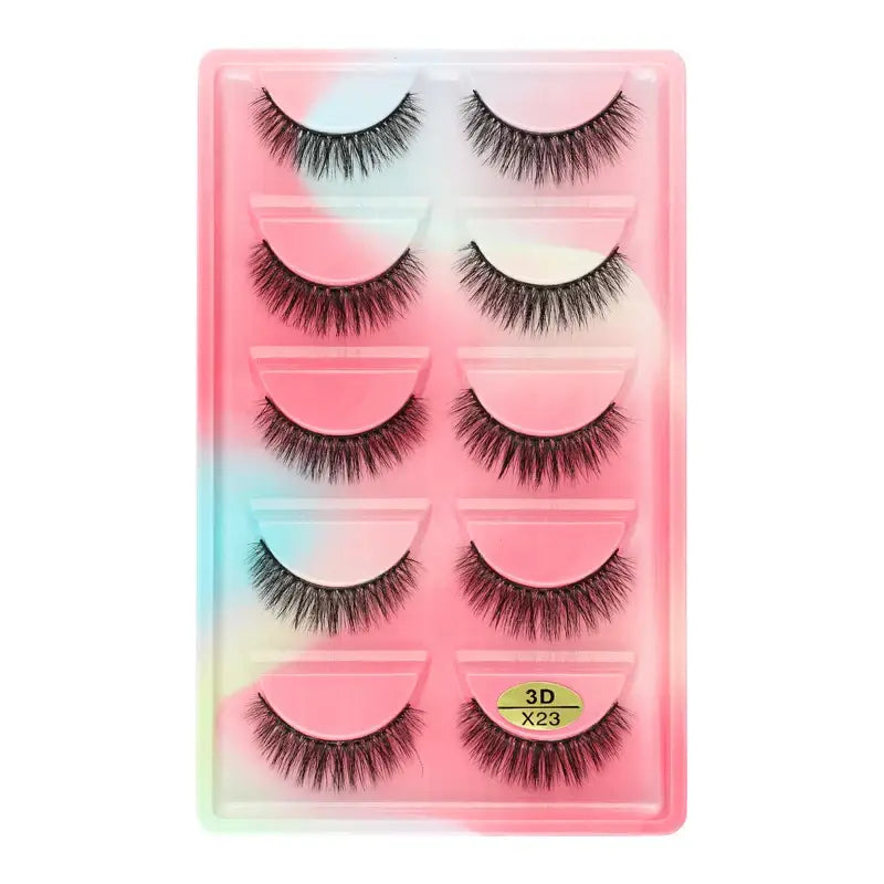 Set of five pairs of false eyelashes in a pastel-colored plastic case.