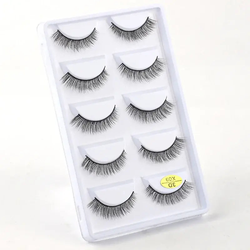 Set of five pairs of false eyelashes in a clear plastic case.