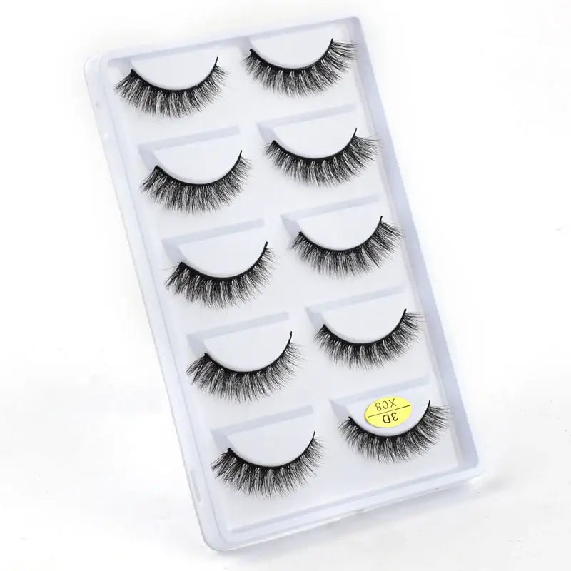 Set of five pairs of false eyelashes in a clear plastic case.