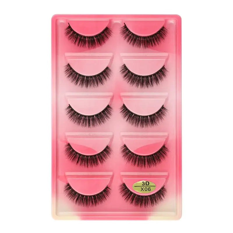 Set of five pairs of false eyelashes in a pink plastic case.