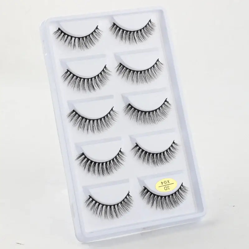 Set of five pairs of false eyelashes in a clear plastic case.