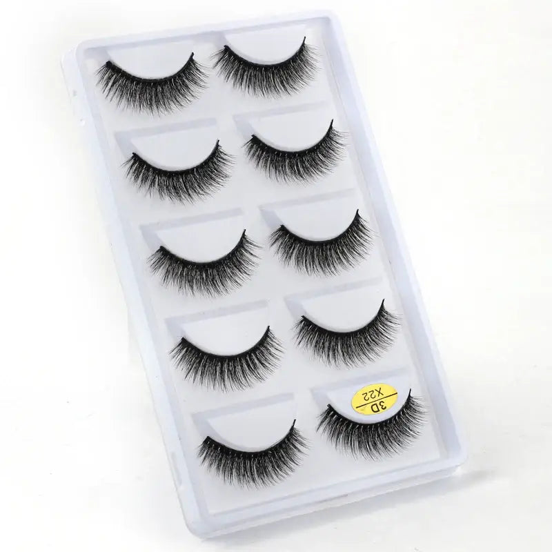 Set of five pairs of false eyelashes in a clear plastic case.