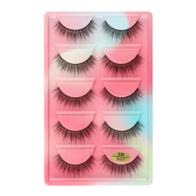 Set of five pairs of false eyelashes in a pink-tinted plastic case.