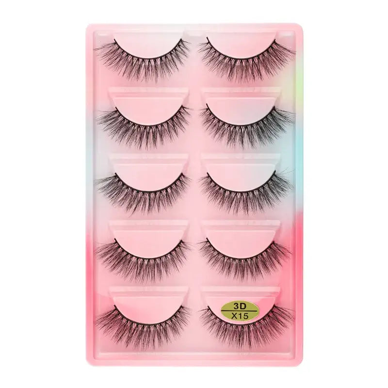 Set of five pairs of false eyelashes in a pink-tinted plastic case.