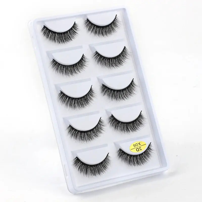 Set of five pairs of false eyelashes in a clear plastic case.