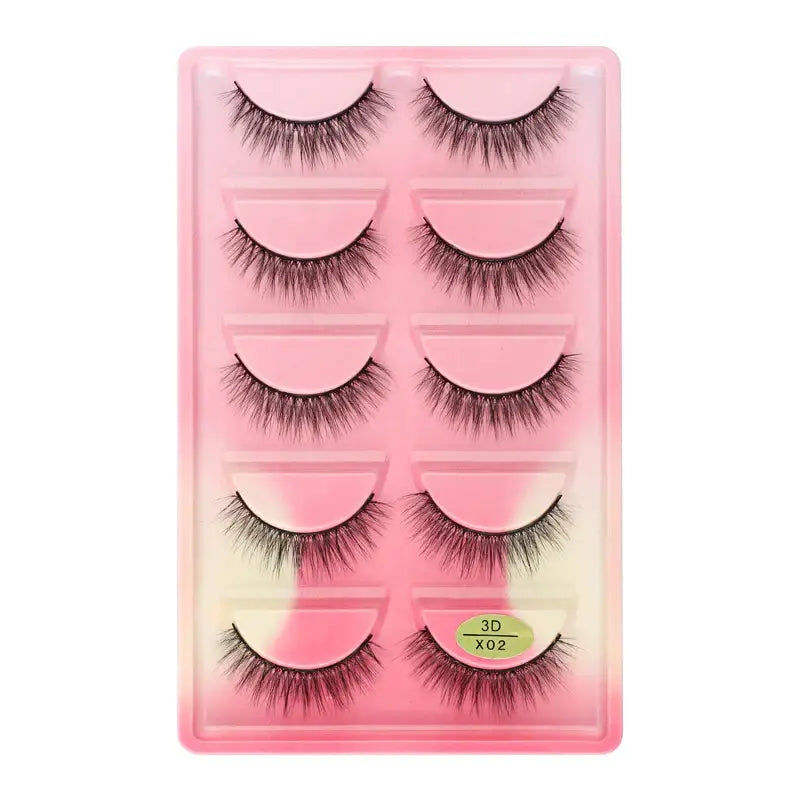 Set of five pairs of false eyelashes in a pink plastic case.