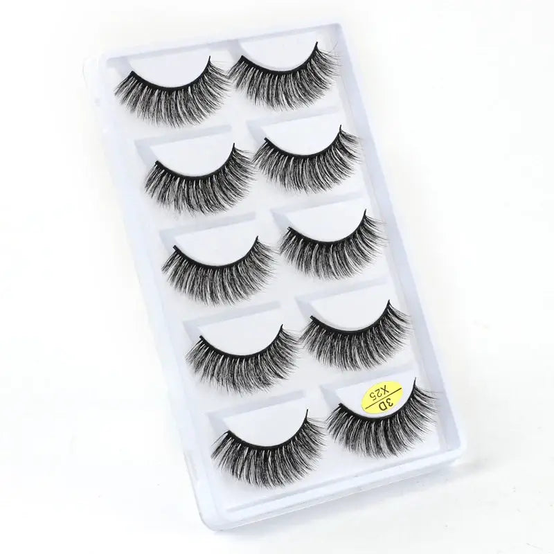 Set of five pairs of false eyelashes in a clear plastic case.