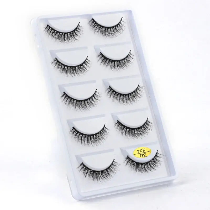 Set of five pairs of false eyelashes in a clear plastic case.