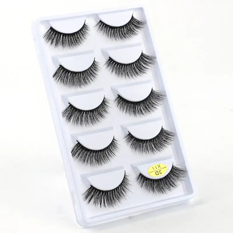 Set of five pairs of false eyelashes in a clear plastic case.