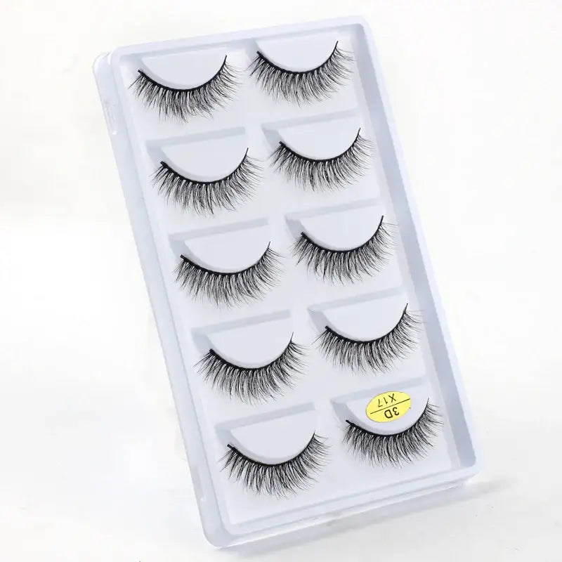 Set of five pairs of false eyelashes in a clear plastic case.