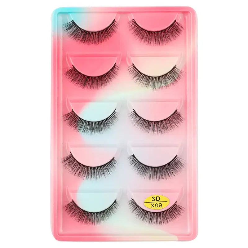 Set of five pairs of false eyelashes in a pink and blue gradient plastic case.