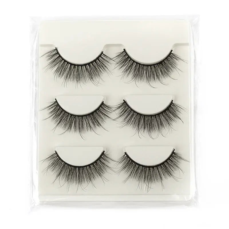 Set of three pairs of false eyelashes in a clear plastic case.