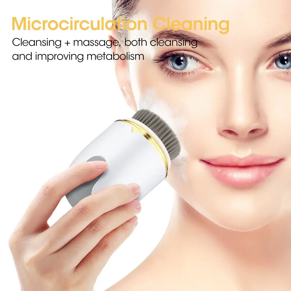 Handheld facial cleansing and massage device with a white cylindrical body.