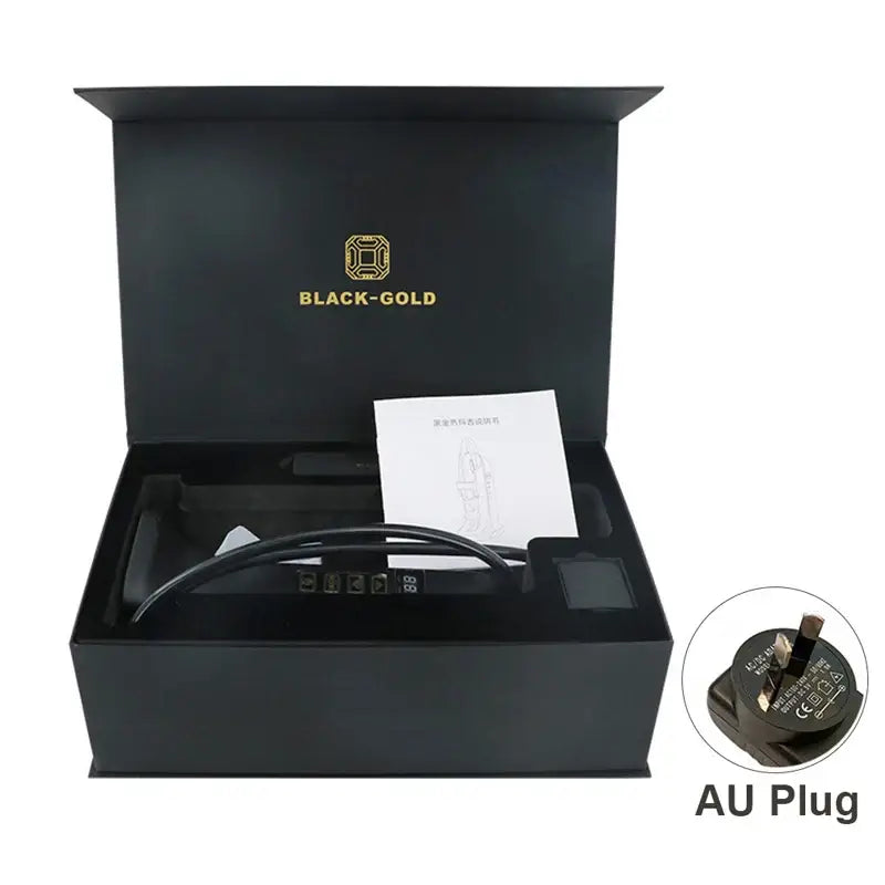 Black gift box containing an electronic device with ’BLACK-GOLD’ branding and an AU plug accessory.