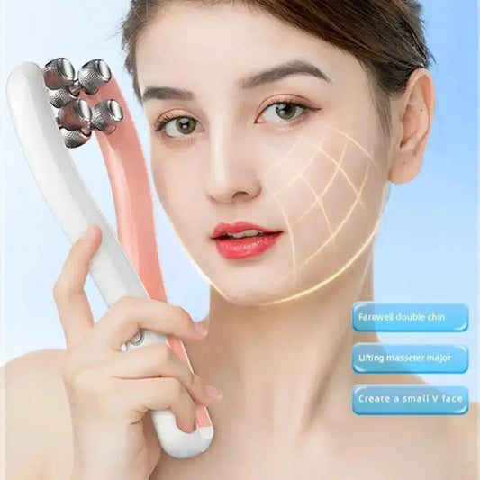 Facial massage roller device with multiple metallic spheres held near a woman’s face.