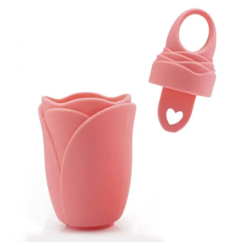 Pink silicone menstrual cup with a heart-shaped pull tab.